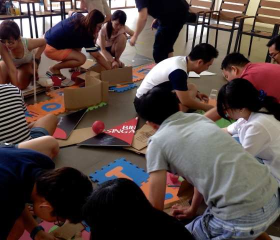 Team-building activities at WOW Bintan, showcasing corporate retreats and community impact projects.
